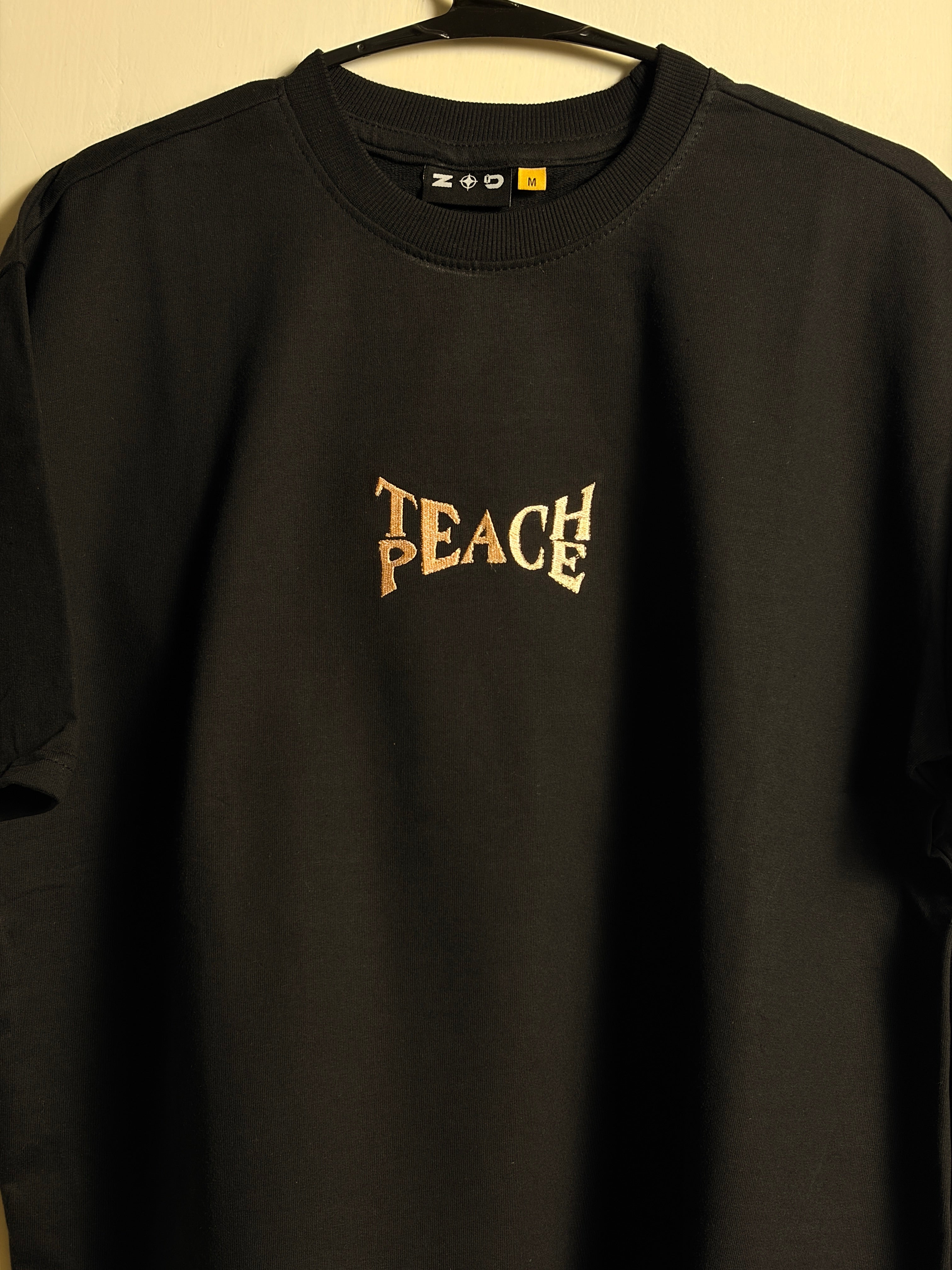 TEACH PEACE EMBROIDERED TSHIRT