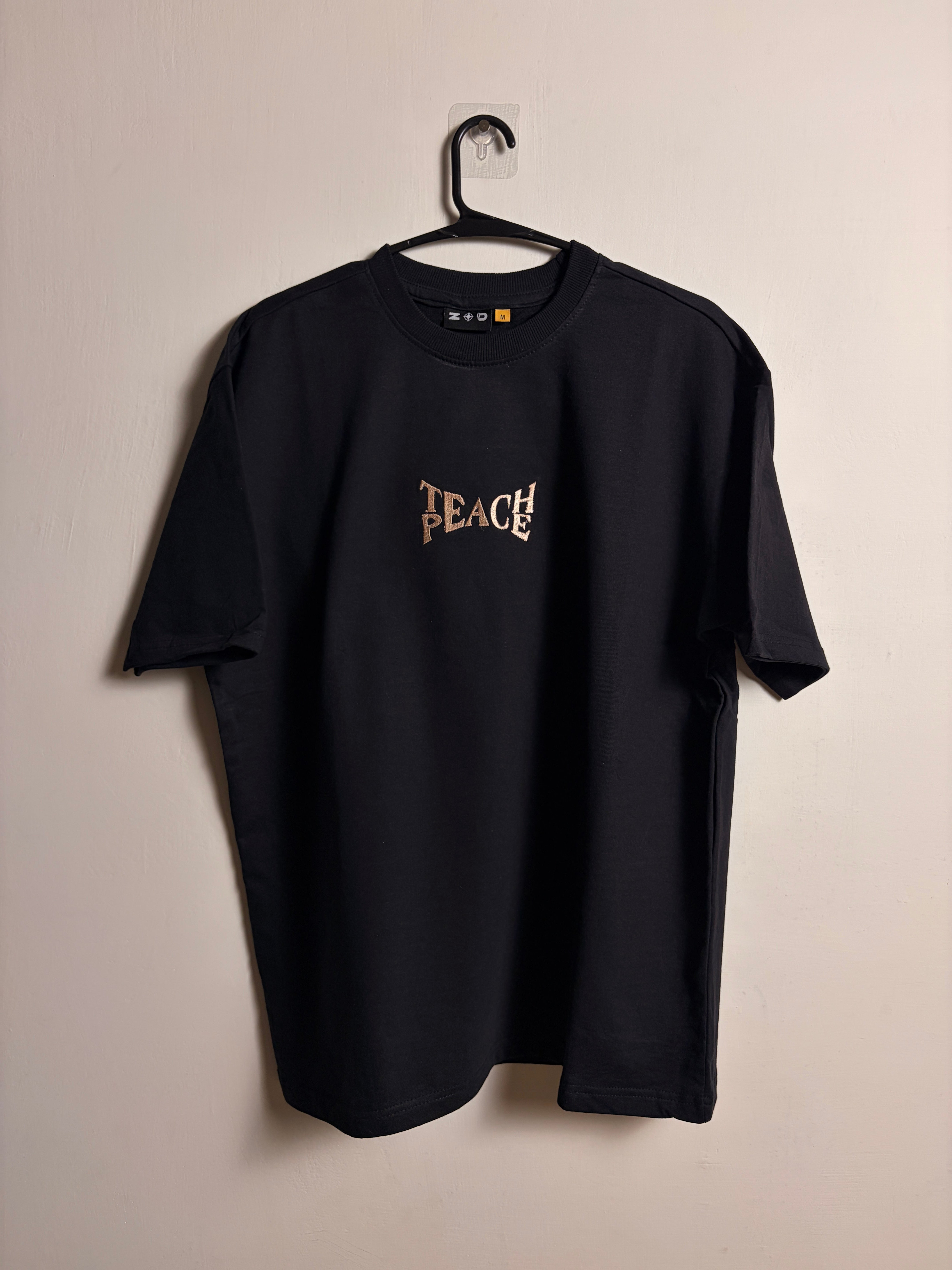 TEACH PEACE EMBROIDERED TSHIRT